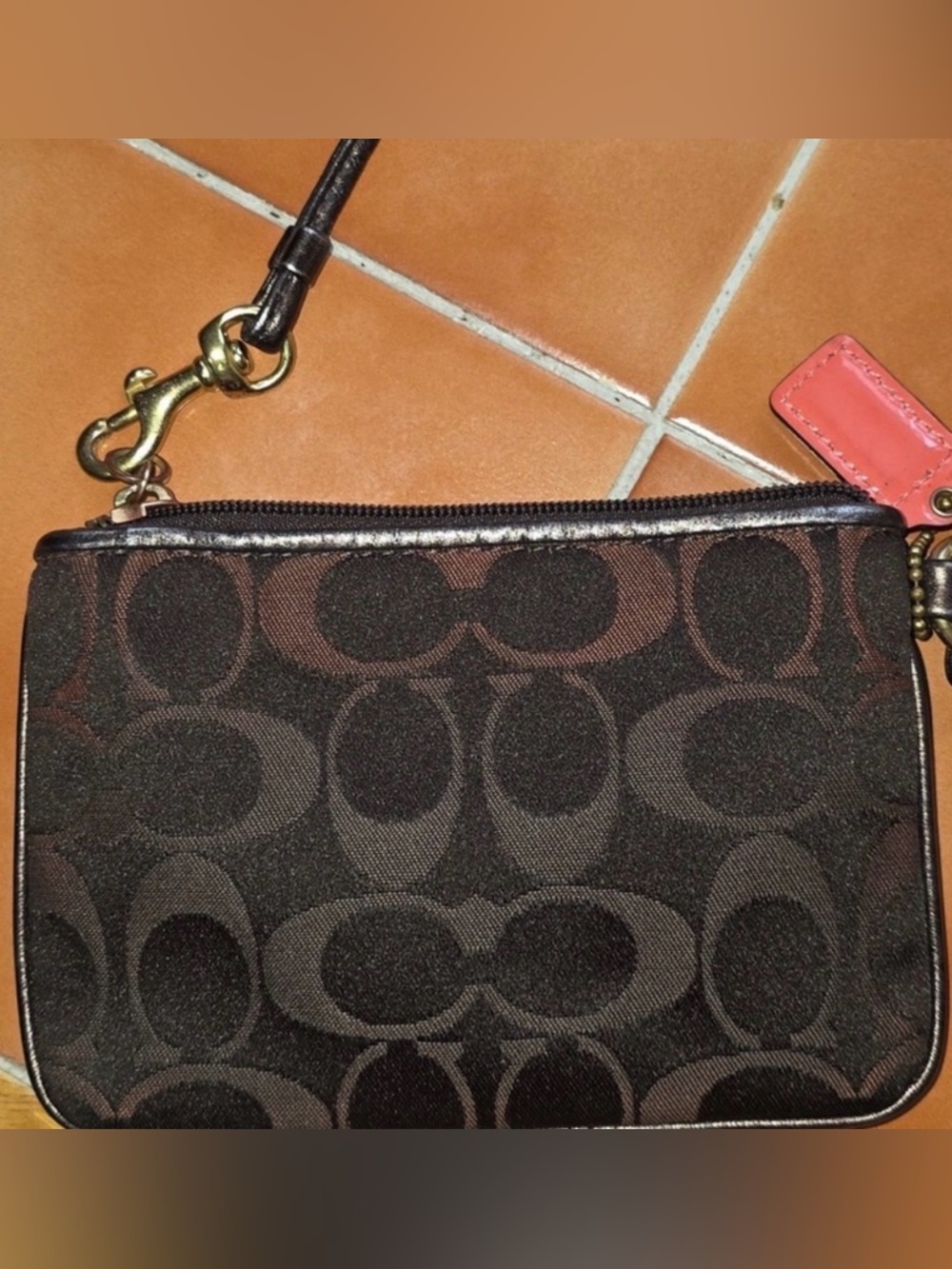 Coach Brown Poppy Signature
Wristlet with Gold Plaque w/ Original Hang Tag GUC - Picture 12 of 14